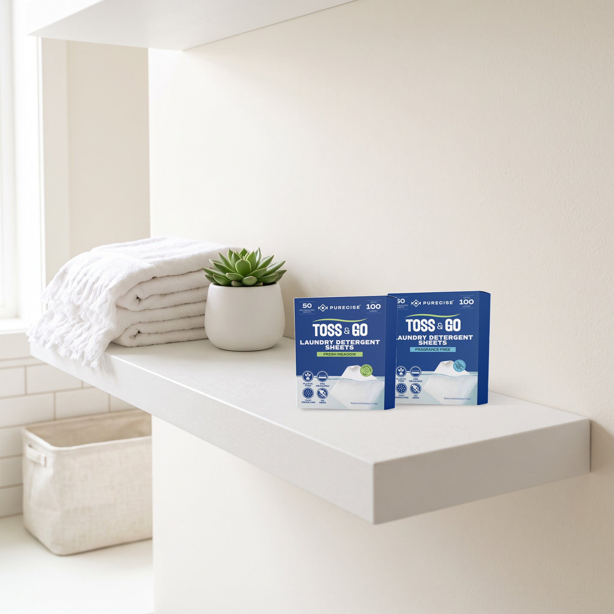 Purecise Toss & Go boxes, Fresh Meadow and Fragrance Free, side by side on a white bathroom shelf